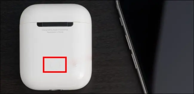 button of airpods connect AirPods to laptops